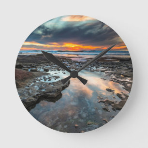 Sonnenuntergang von den Gezeitenpools Runde Wanduhr
