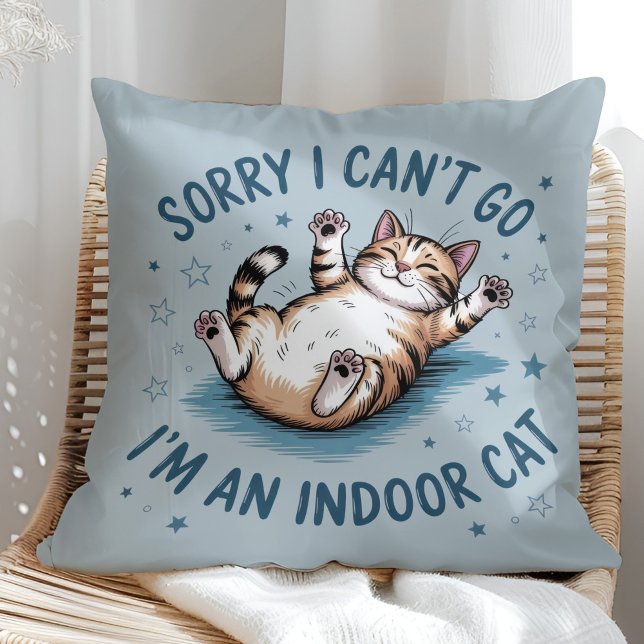 "Sorry I Can't Go, I'm an Indoor Cat" Funny Kissen ("Sorry I Can't Go, I'm an Indoor Cat" Funny Throw Pillow in a sunny boho rattan chair.)