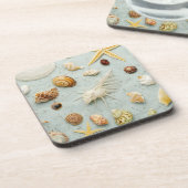 Sortierte Seashells auf blauem Hintergrund Untersetzer (Linke Seite)
