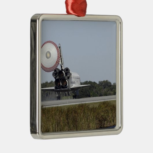 Space Shuttleservice Atlantis entfaltet seinen Dra Silbernes Ornament (Rechts)