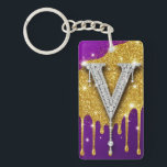 Sparkling Letter V With Gold Glitter Drip Schlüsselanhänger<br><div class="desc">Sparkling diamond-encrusted letter V set against a gold glitter field with dripping metallic effect and vivid purple background,  evoking luxury,  glam monogram style,  celebration and high-fashion bling.</div>