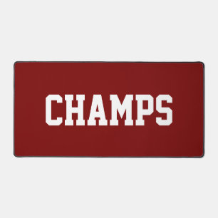 Spaß Weißer Athletik-CHAMPS-Text auf Vintage-Rot Schreibtischunterlage