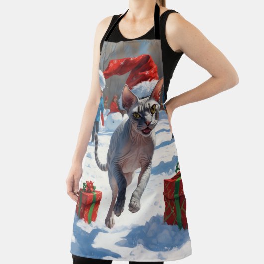 Sphynx Cat läuft im Schnee mit Weihnachtsmütze Schürze (InSitu)