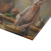 Sphynx-Katze kocht in der Küche Schneidebrett (Ecke)