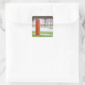 Spieler im Hintergrund. Quadratischer Aufkleber (Tasche)