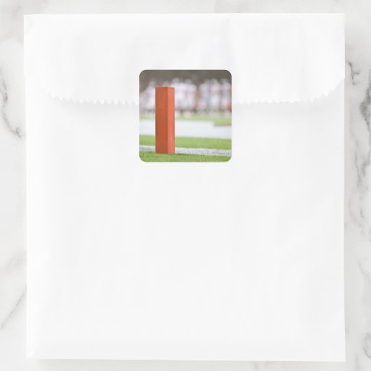 Spieler im Hintergrund. Quadratischer Aufkleber (Tasche)