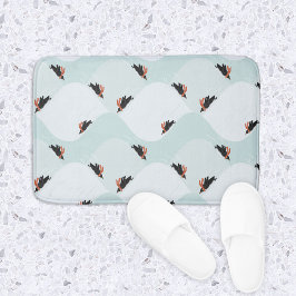 Spielerische Pinguine, die auf dem Schneepattern g Badematte