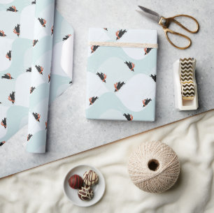 Spielerische Pinguine, die auf dem Schneepattern g Geschenkpapier