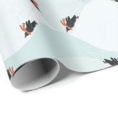 Spielerische Pinguine, die auf dem Schneepattern g Geschenkpapier (Rolleneckpunkt)