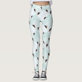 Spielerische Pinguine, die auf dem Schneepattern g Leggings