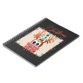 Spielerischer Rentier mit Geschenk Notizblock (Linke Seite)