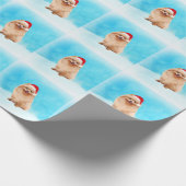 Spitz Hund sitzend am Weihnachtshut am Strand Geschenkpapier (Ecke)