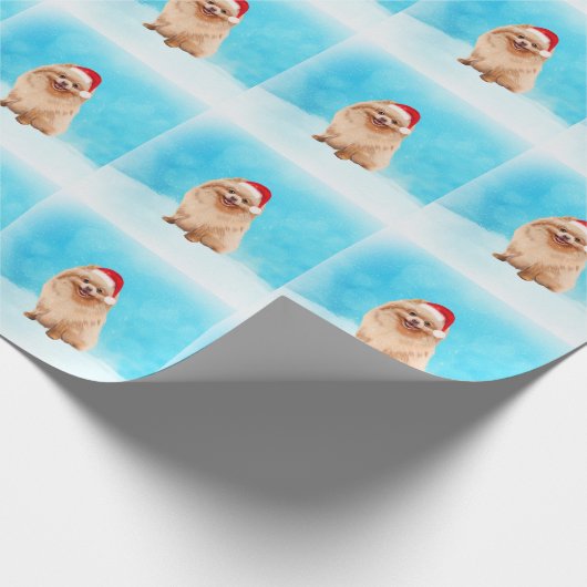Spitz Hund sitzend am Weihnachtshut am Strand Geschenkpapier (Ecke)