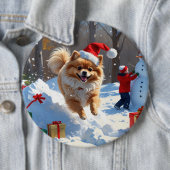 Spitz läuft im Schnee mit Weihnachtshut Button (Beispiel)