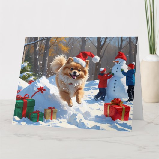 Spitz läuft im Schnee mit Weihnachtshut Karte (Vorderseite)