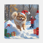 Spitz läuft im Schnee mit Weihnachtshut Magnet (Vorne)