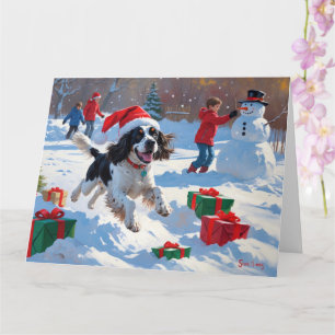 Springer Spaniel Running Snow mit Weihnachtshut Karte