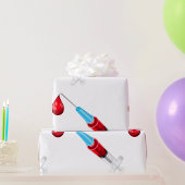 Spritze mit rotem Tropfen Geschenkpapier