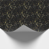 Spritzer mit Goldfarbe auf schwarz Geschenkpapier (Ecke)
