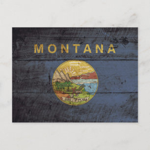 Staatsflagge von Montana auf Altholzkörnern Postkarte