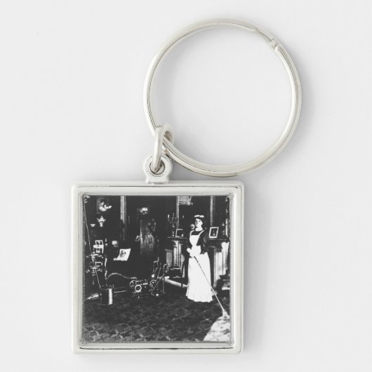 Staubsauger bei der Arbeit Schlüsselanhänger (Vorne)