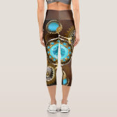 Steampunk Rusty Hintergrund mit türkisfarbenen Lin Capri Leggings (Rückseite)