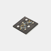 Steampunkdrachenfliegen auf braunem, gestreiften H Post-it Klebezettel (angewinkelt)