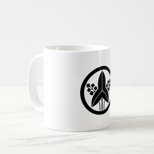 Stehende Pfeilspitze in einem Kreis Kaffeetasse (Vorderseite Links)