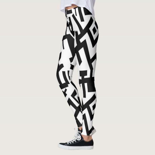 Steinbock-Schwarz-weiße Leggings (Links)