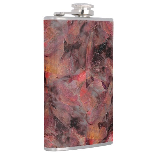 Steine in roten Farbtönen auf schwarz-grauem Hinte Flachmann (Rechts)