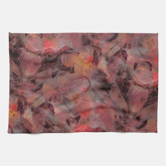 Steine in roten Farbtönen auf schwarz-grauem Hinte Geschirrtuch (Horizontal)