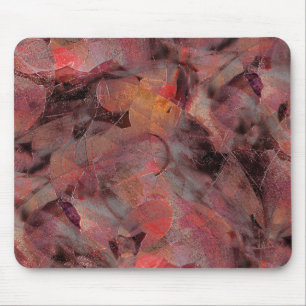 Steine in roten Farbtönen auf schwarz-grauem Hinte Mousepad