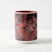 Steine in roten Farbtönen auf schwarz-grauem Hinte Tasse (Zentrum)