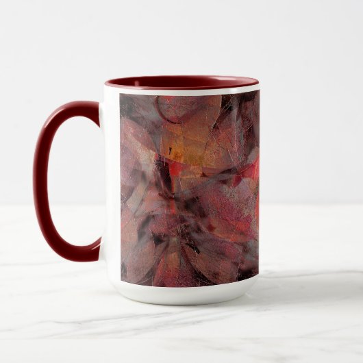 Steine in roten Farbtönen auf schwarz-grauem Hinte Tasse (Links)