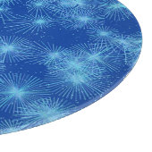 Sternexplosionen aus Eiskristall, blauer Hintergru Schneidebrett (Ecke)