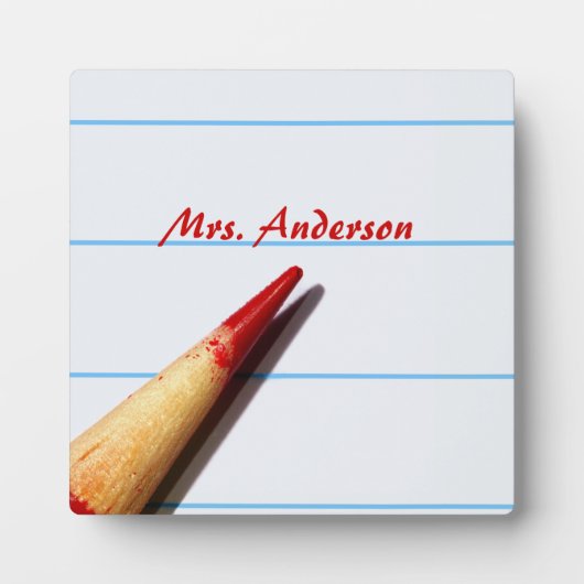 Stift des roten Lehrers auf gestrichenem Papier mi Fotoplatte (Vorderseite)