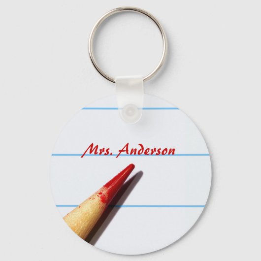 Stift des roten Lehrers auf gestrichenem Papier mi Schlüsselanhänger (Vorderseite)