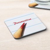 Stift des roten Lehrers auf gestrichenem Papier mi Untersetzer (Linke Seite)