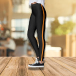 Stilvolle schwarze Leggings mit orangefarbenem Str<br><div class="desc">Diese eleganten und komfortablen schwarzen Leggings mit einem fett orangefarbenen Streifen ergänzen Ihren lässigen Kleiderschrank. Sie sind sowohl für Fitness als auch für Mode konzipiert und zeichnen sich durch eine geschmackvolle Passform und einen auffälligen Stil aus. Egal ob Sie im Fitnesscenter trainieren oder Sport treiben, diese Leggings bieten die perfekte...</div>