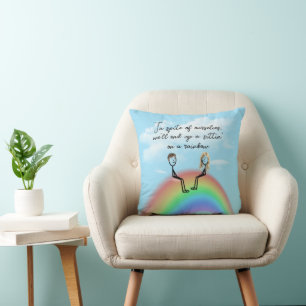 Strichmännchen auf einem Regenbogen Kissen