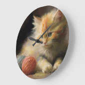 Strick macht Orange Kitten mit Garn große Uhr (Winkel)