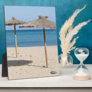Strohdach-Strandsonnenschirme Fotoplatte