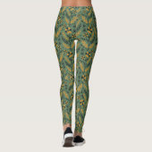 Stylized botanical orange and black floral pattern leggings (Rückseite)