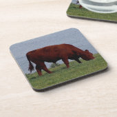 Südkarminrote Kuh Grazeing Devons auf Küstenlinie Untersetzer (Linke Seite)