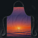Sunset Horizon Apron Schürze<br><div class="desc">This apron features a serene sunset design with a gradient sky shifting from deep purple to glowing orange at the horizon. The sun casts a warm light over calm ocean waves, while birds soar gracefully across the sky, adding movement to the tranquil scene. Combining vivid colors with peaceful imagery, this...</div>