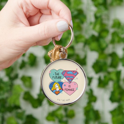 Supergirl aus dieser Welt Retro Grafik Schlüsselanhänger (Hand)