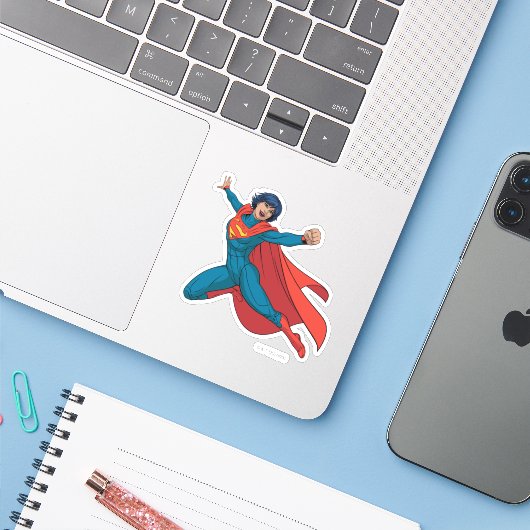 Supergirl Fliegen in Blue Anzug Aufkleber (Laptop mit iPhone)