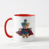 Superhelden-Teddybär mit Mütze. Tasse (Links)