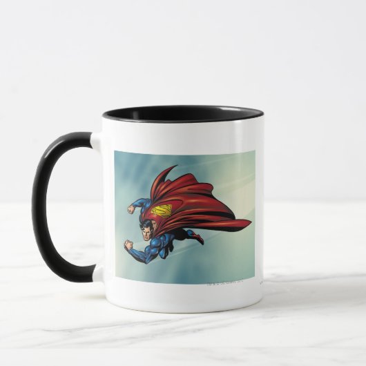 Superman fliegt mit Kap Tasse (Links)
