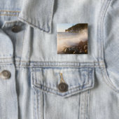Surf wäscht über die Kopfsteinpflaster im Denkmal Button (Beispiel)